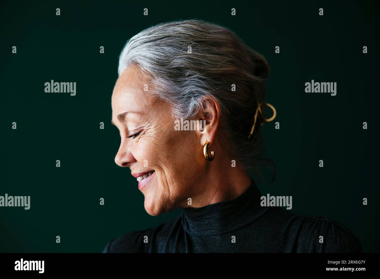 Woman grey hair in green hi-res stock photography and images - Alamy