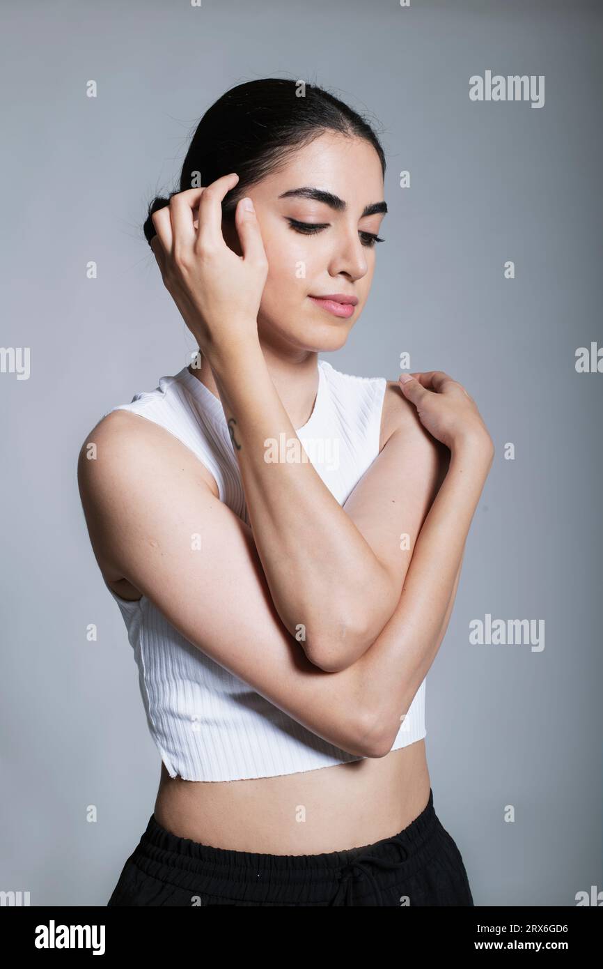 Beautiful young woman with eyes closed posing in studio Stock Photo - Alamy