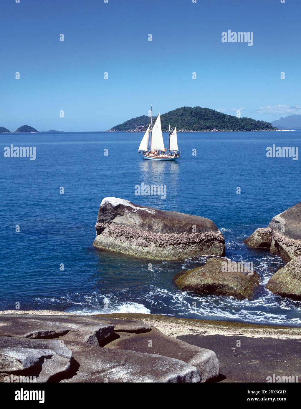 Australia. Queensland. Great Barrier Reef.  Family Islands. Coast view with Ise Pearl Sailboat. Stock Photo
