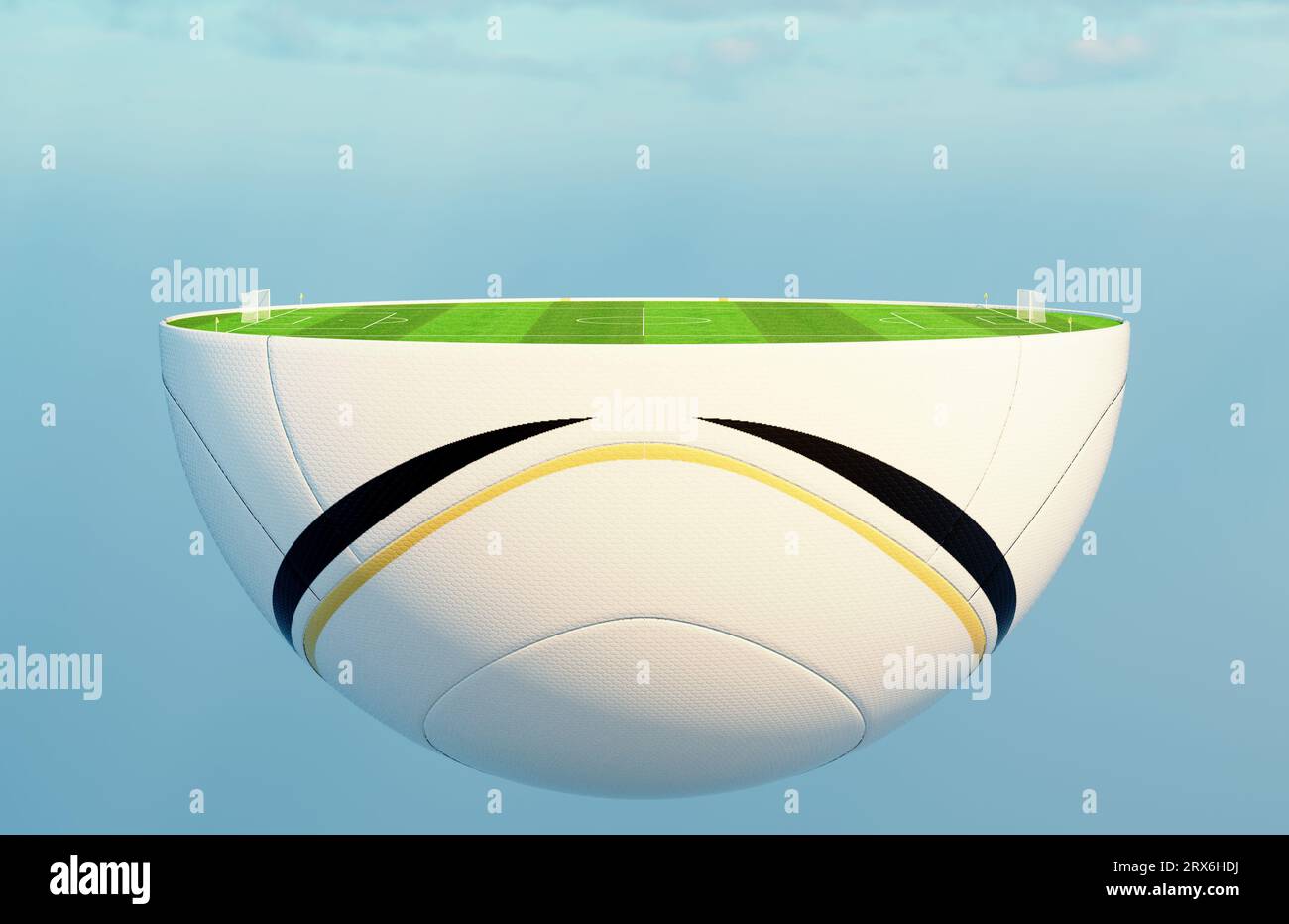 A soccer ball split in half revealing a marked green grass football