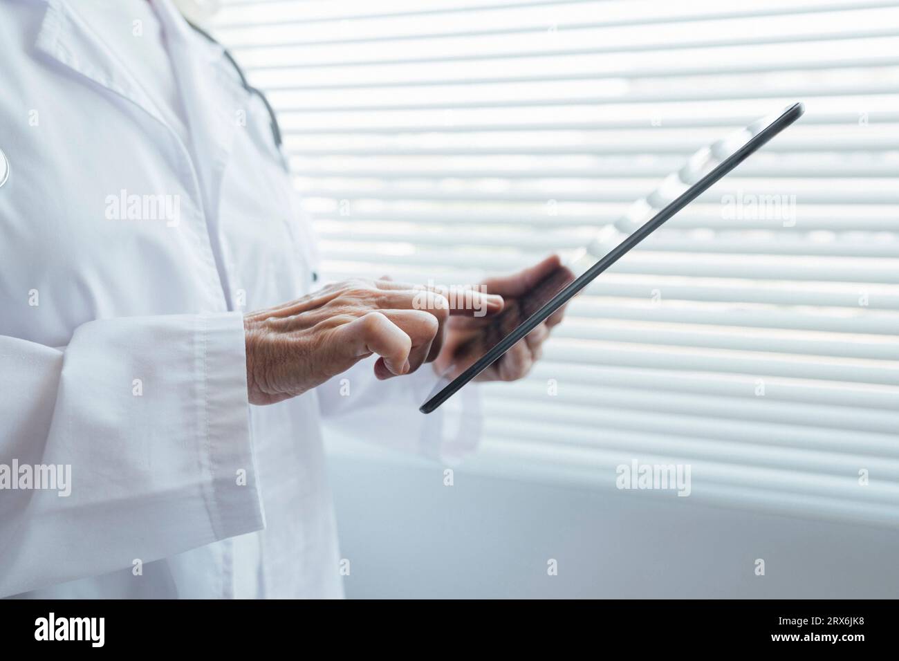 Female doctor touching senior hi-res stock photography and images - Alamy