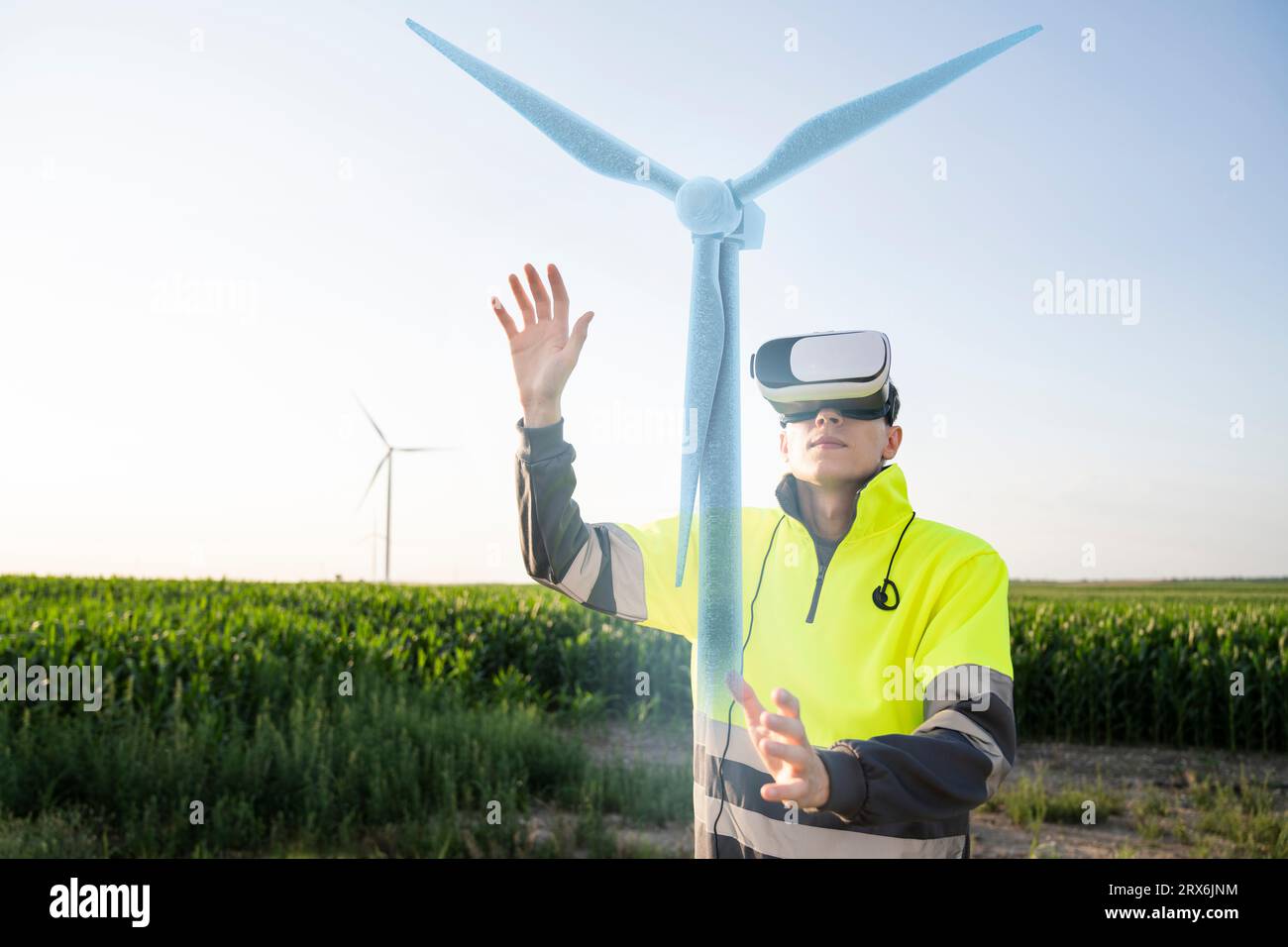 Engineer examining augmented wind turbine model through VR simulator Stock Photo