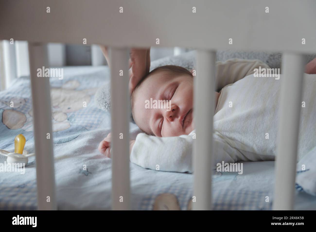 Baby girl sleeping in crib at home Stock Photo Alamy