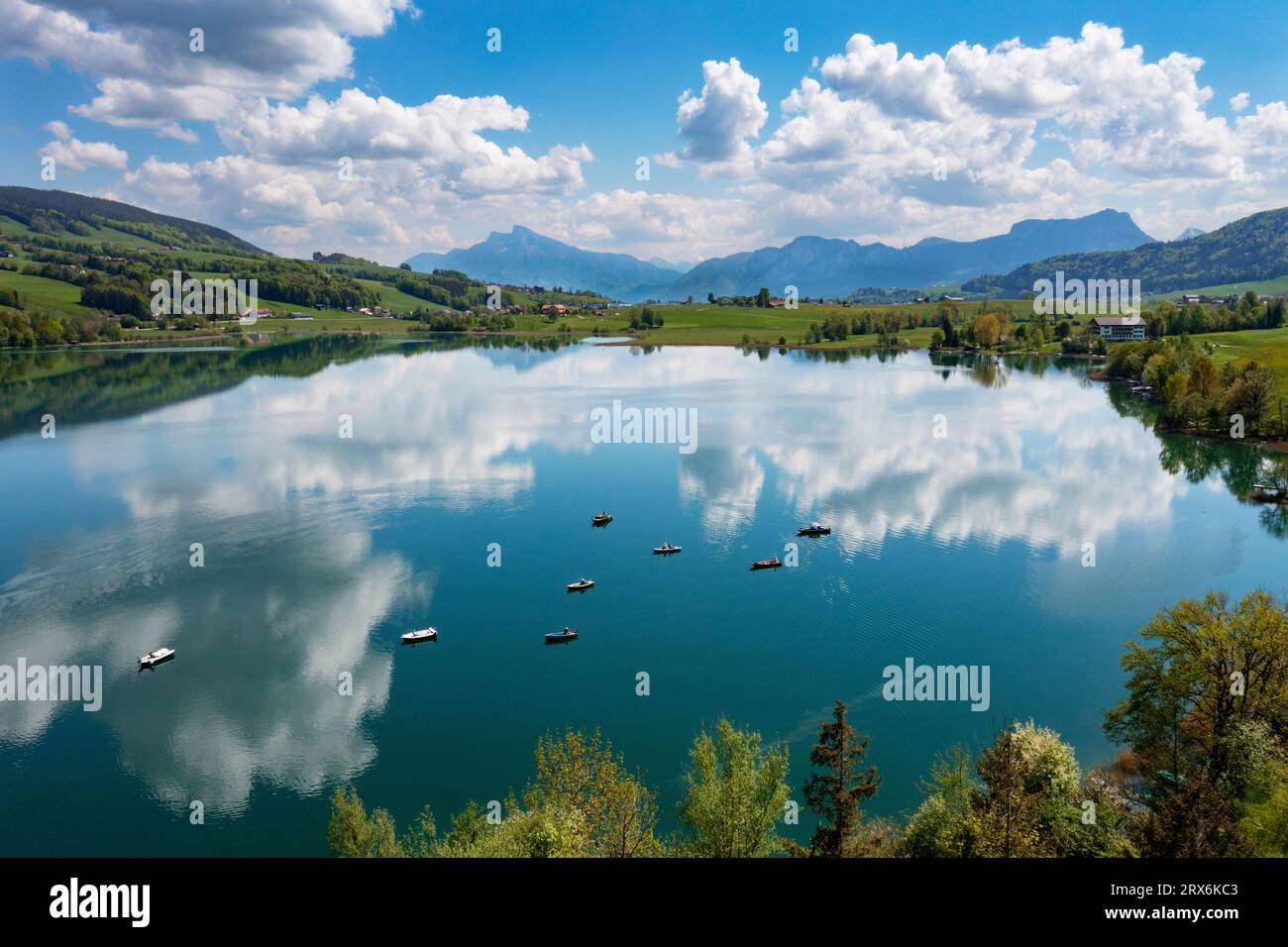 Austria, Upper Austria, Zell am Moos, Drone view of summer clouds reflecting in Irrsee lake Stock Photo