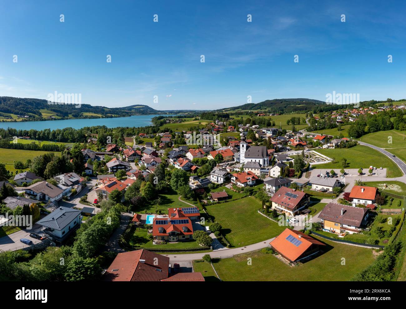 Austria, Upper Austria, Zell am Moos, Drone view of lakeshore town in summer Stock Photo