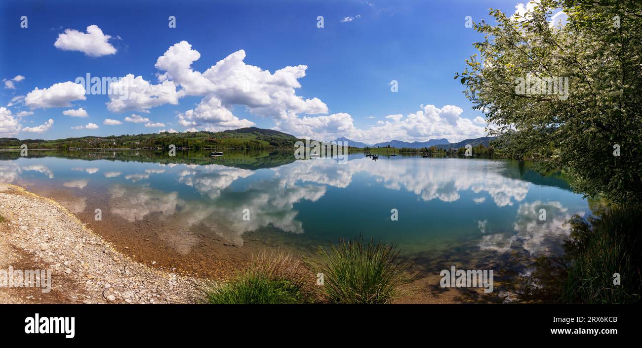 Austria, Upper Austria, Zell am Moos, Drone panorama of summer clouds reflecting in Irrsee lake Stock Photo