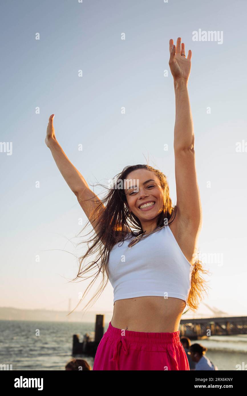 Woman arms raised sky hi-res stock photography and images - Alamy