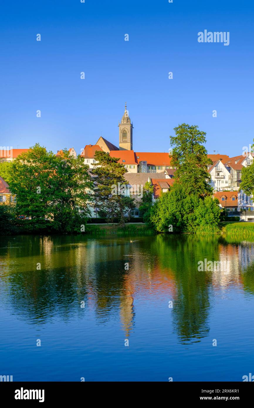 Germany, Baden-Wurttemberg, Pfullendorf, Lake with historic houses in background Stock Photo
