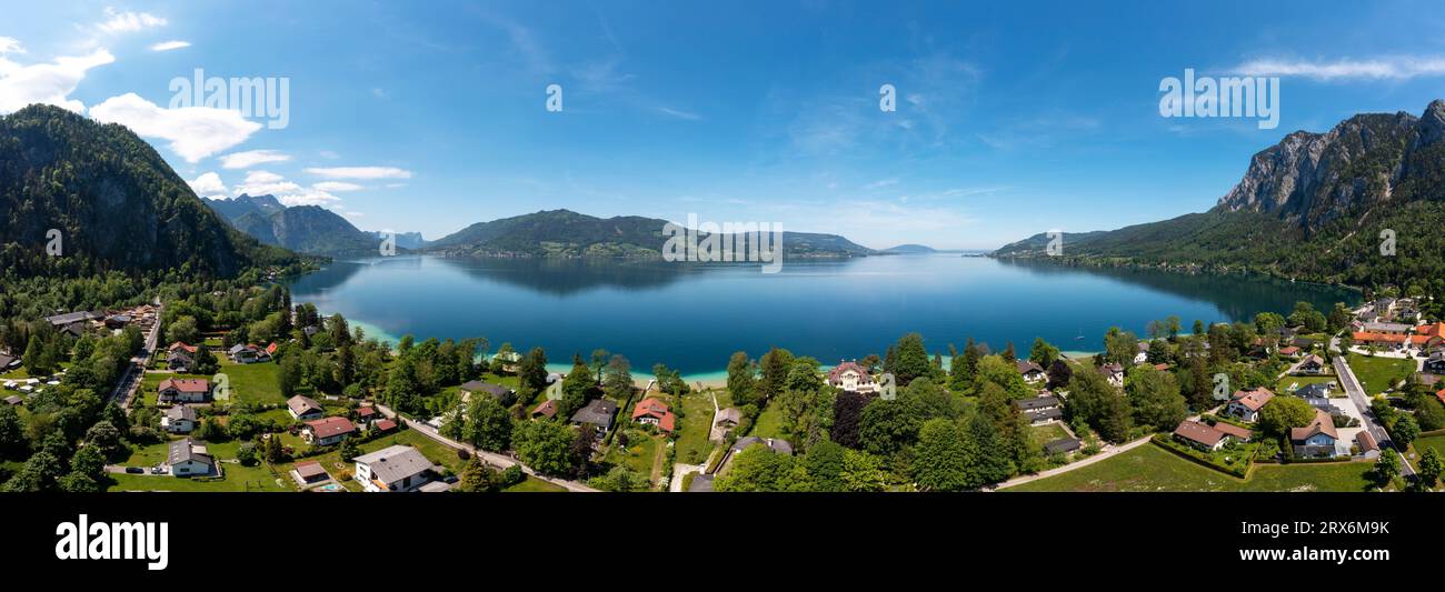 Austria, Upper Austria, Weissenbach am Attersee, Drone panorama of Lake Atter and surrounding village in summer Stock Photo