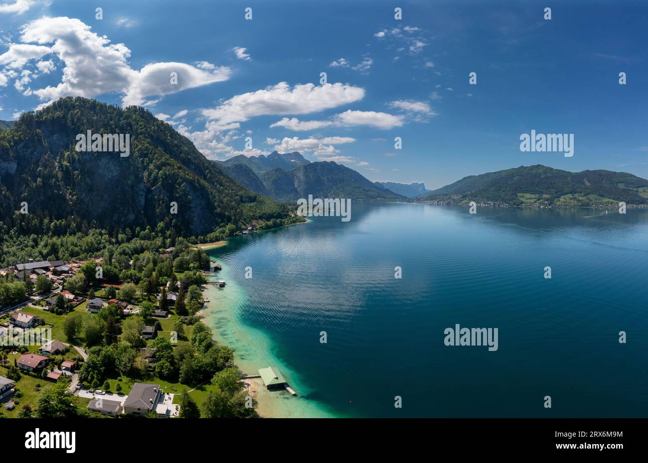 Austria, Upper Austria, Weissenbach am Attersee, Drone view of Lake Atter and surrounding village in summer Stock Photo