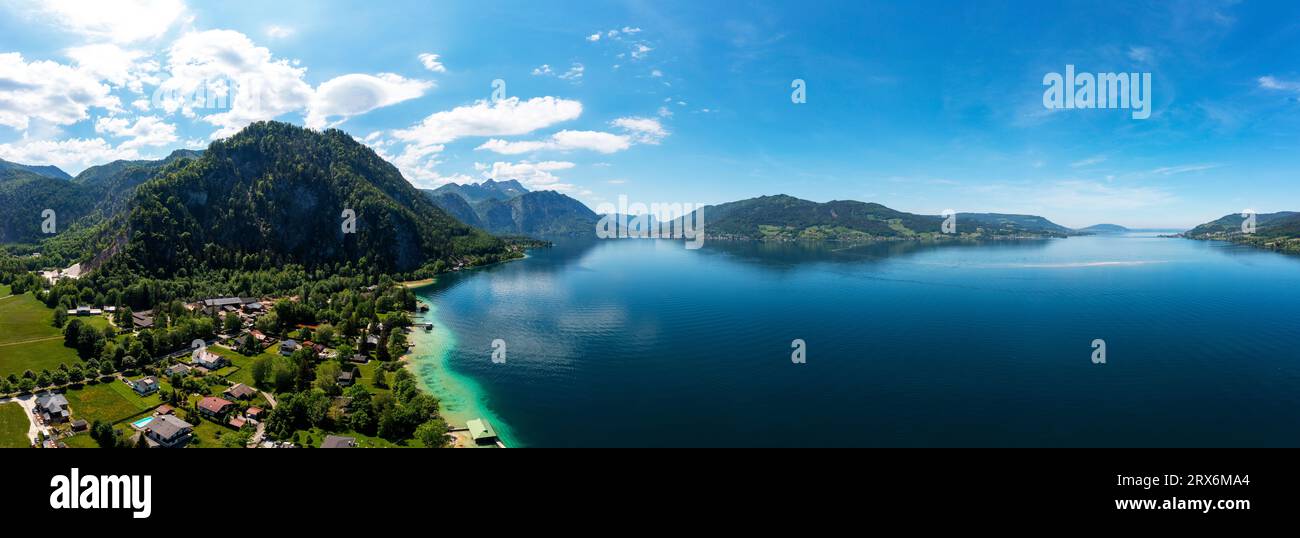 Austria, Upper Austria, Weissenbach am Attersee, Drone panorama of Lake Atter and surrounding village in summer Stock Photo