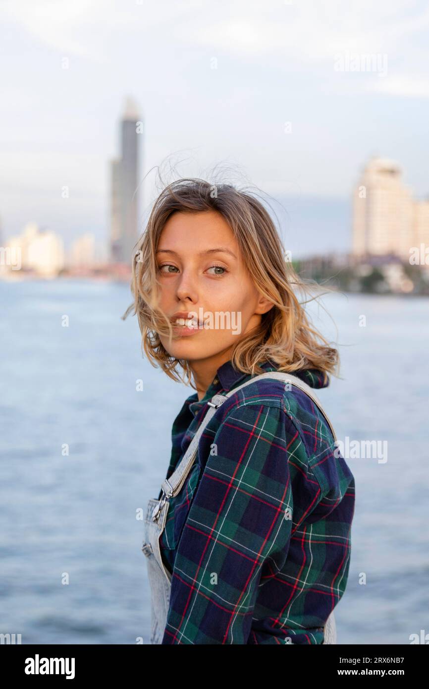 Woman standing in front of sea hi-res stock photography and images - Alamy
