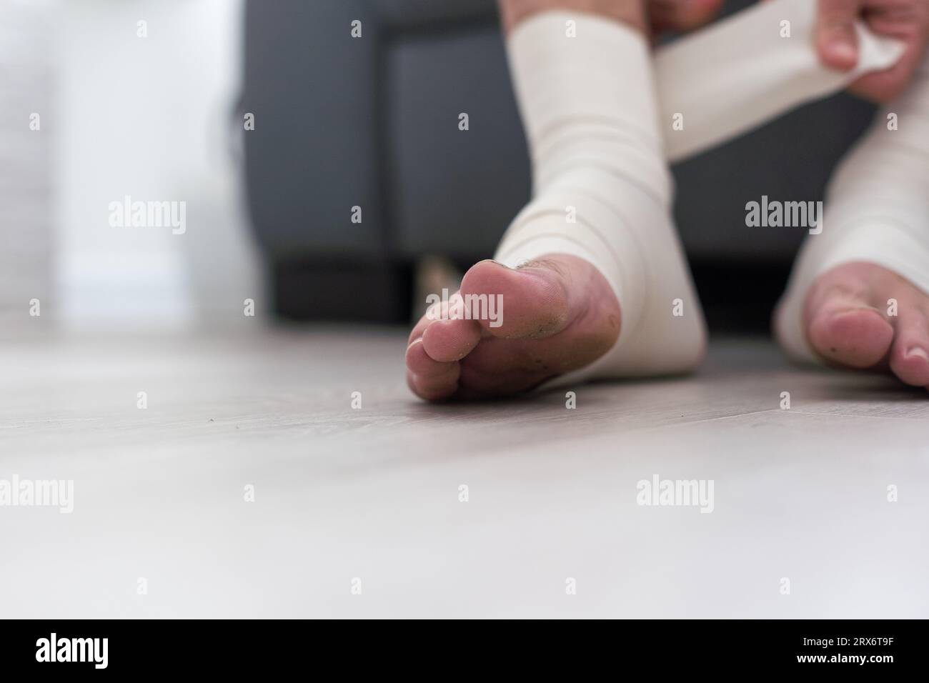 man using put on elastic bandage with legs having leg pain Stock Photo