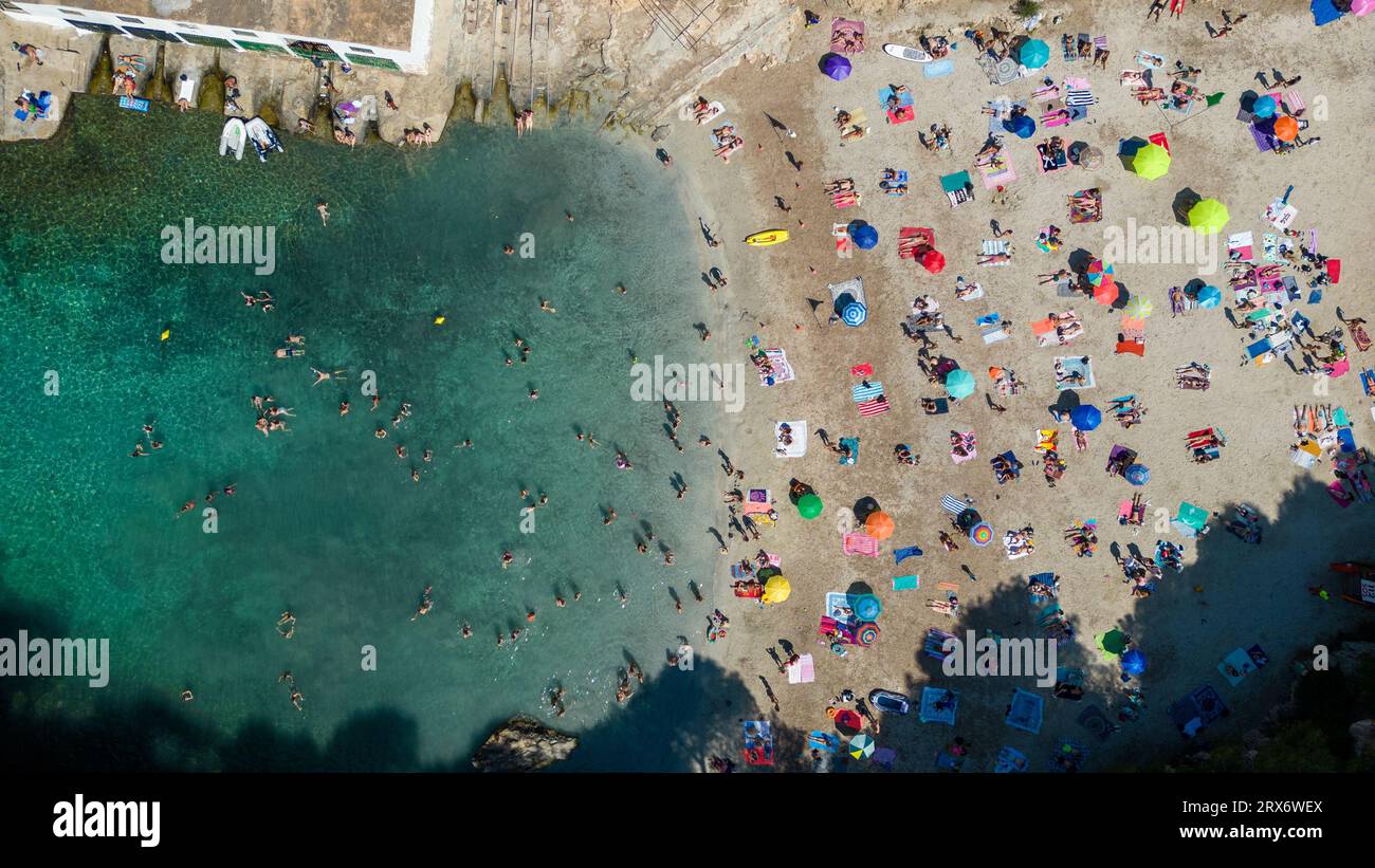 Picture dated June 25th shows a drone image of busy beach in Cala Pi in Majorca in the  Balearic Islands,Spain. Stock Photo