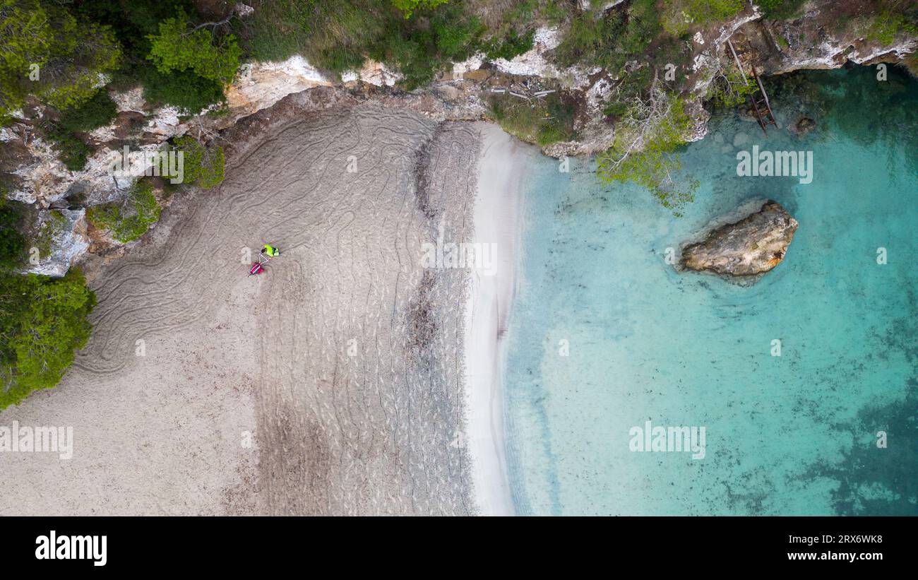 Picture dated September 14th shows council workers cleaning the beach in Cala Pi in Mallorca,Spain, at daybreak on Thursday in preparation for the day Stock Photo