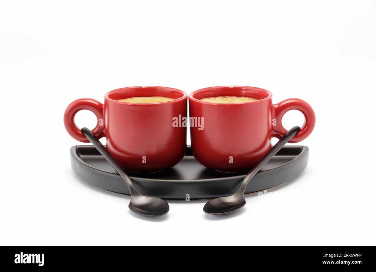 Two small red cups filled with strong Americano cut out Stock Photo