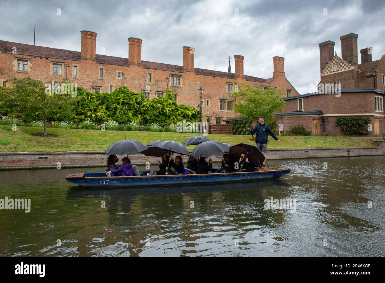 Picture dated September 20th shows people in the high winds and rain in Cambridge whilst they go for a punt on the River Cam on Wednesday afternoon. Stock Photo