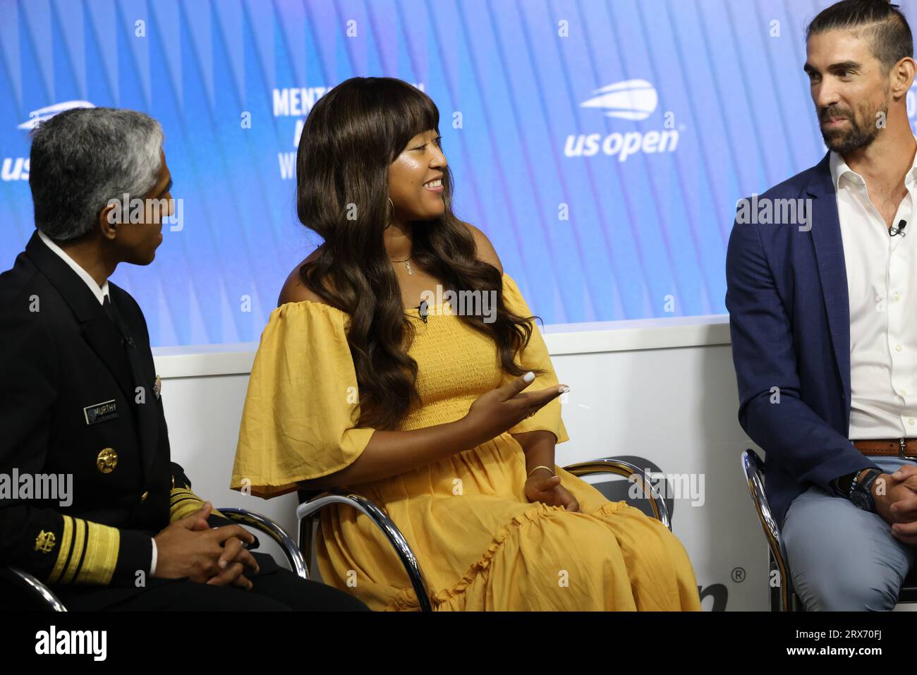 Tennis player Naomi Osaka and Olympic swimmer Michael Phelps share a laugh during Mental Health and Sport Press conference at US Open on 6 September 2023.  From Left to Right:  Also in attendance were US Surgeon General  Dr. Vivek H. Murthy, and USTA President Dr. Brian Hainline Stock Photo