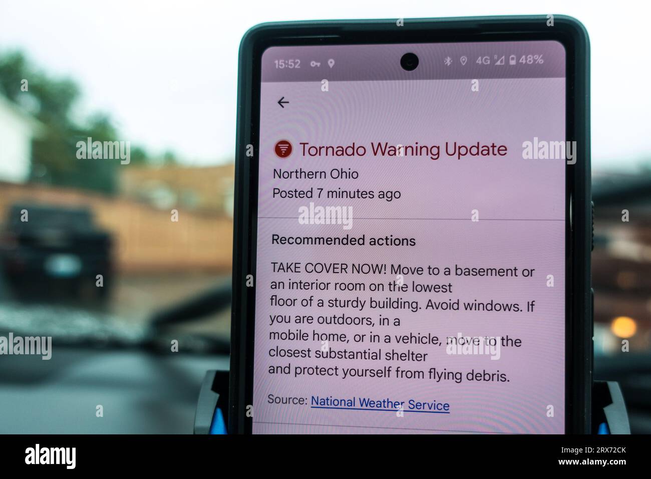 Torando warning update on mobile phone Stock Photo