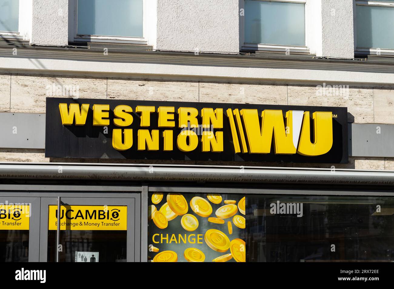 Western Union logo sign of the financial service company. The icon is on a branch store facade. The business is about money transfers in any country. Stock Photo