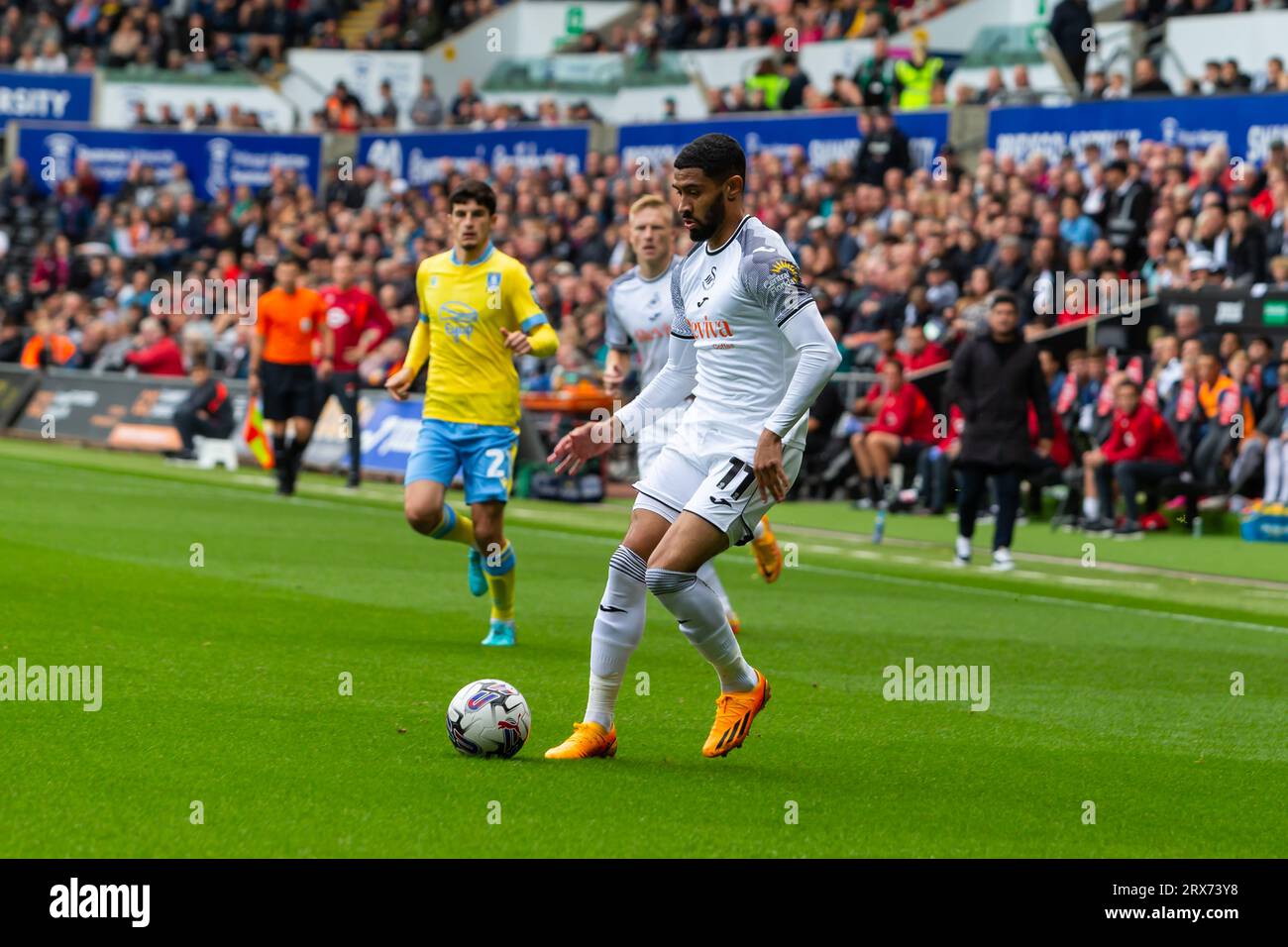 Swansea.com Stadium, Swansea, UK. 23rd Sep, 2023. EFL Championship Football, Swansea City versus Sheffield Wednesday; Swansea City forward Josh Ginnelly passes into midfield Credit: Action Plus Sports/Alamy Live News Stock Photo