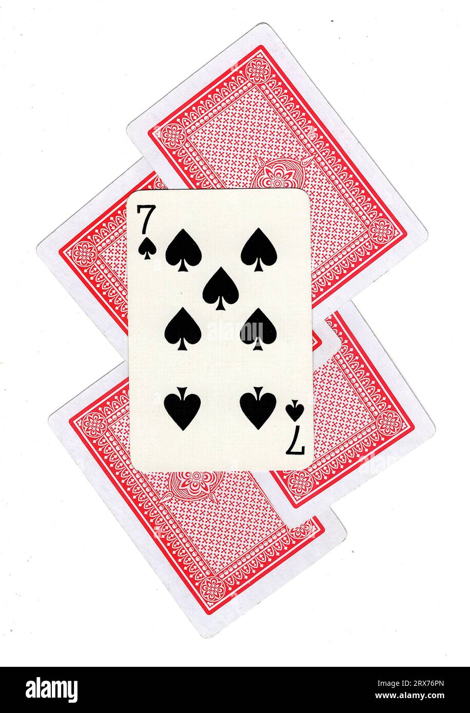 A montage of vintage playing card backs with the seven of spades revealed Stock Photo Alamy