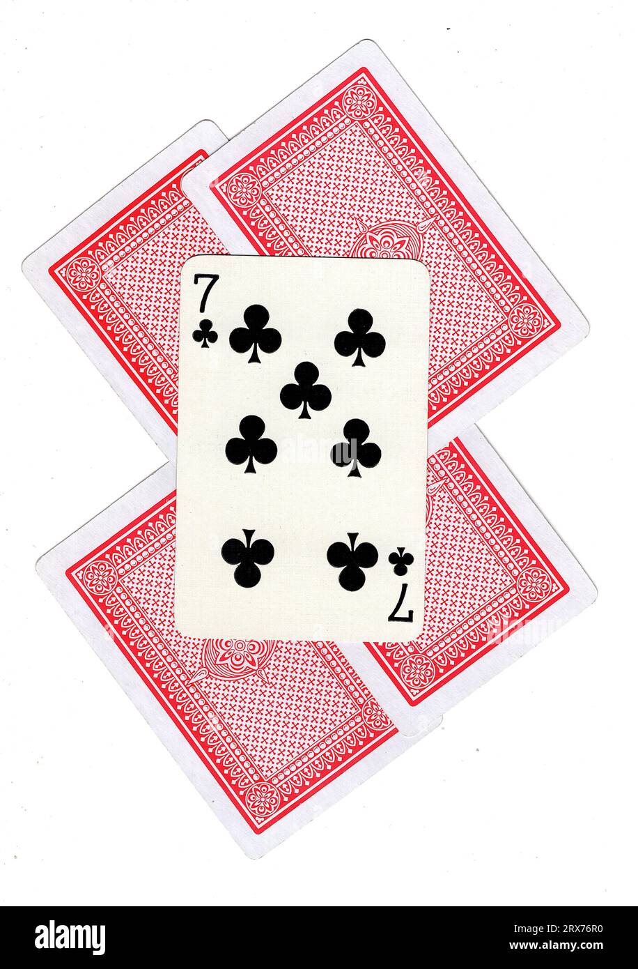 A montage of vintage playing card backs with the seven of clubs revealed. Stock Photo