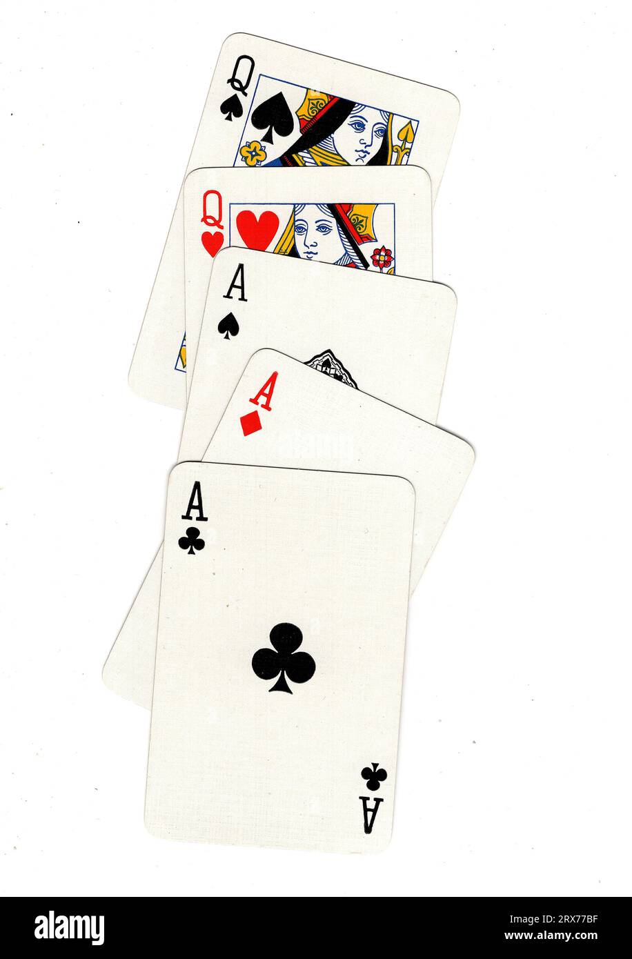 A hand of vintage poker playing cards featuring a full house of aces