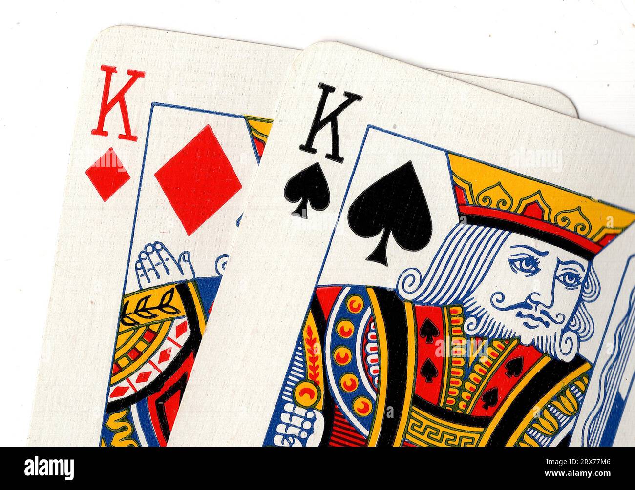 Vintage playing cards showing a pair of kings on a white background