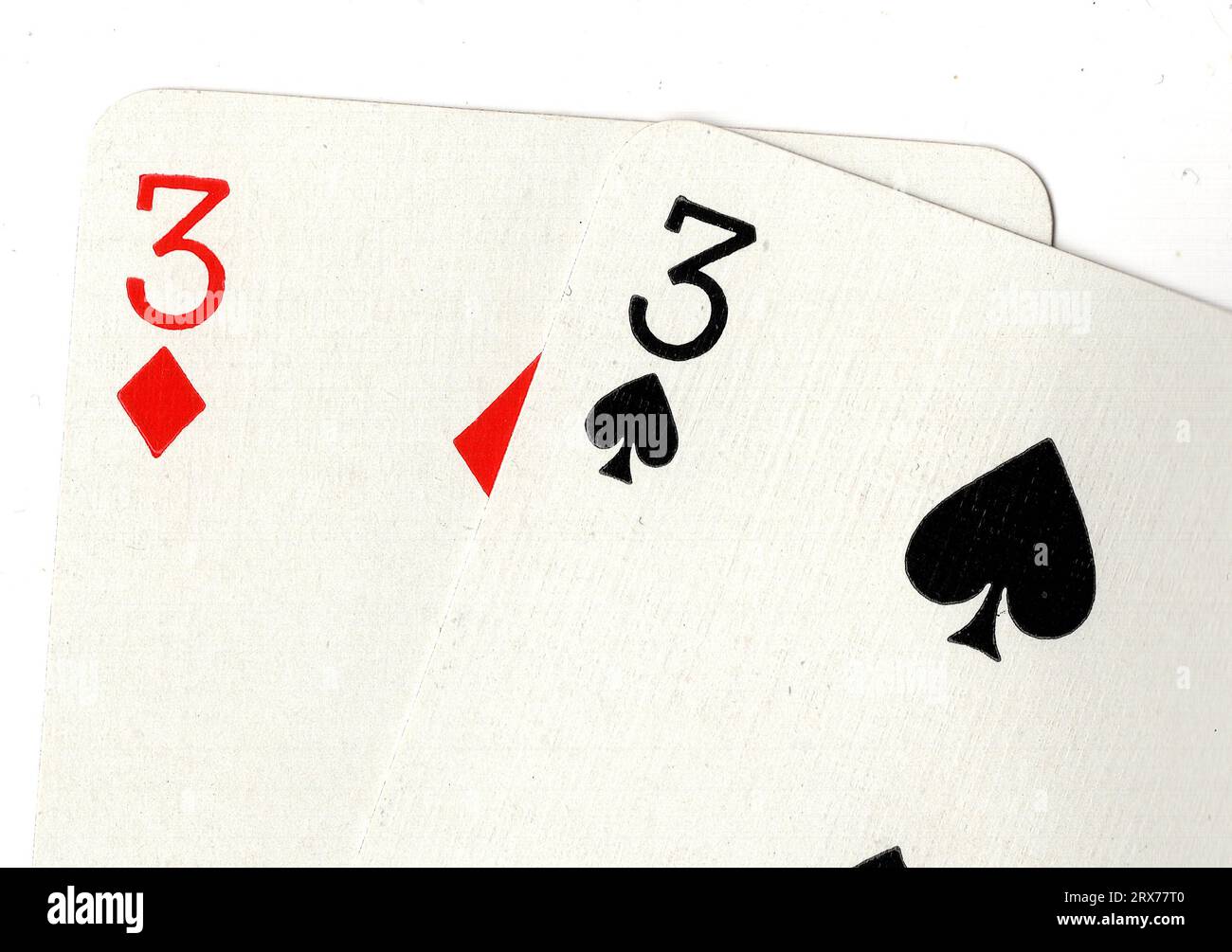 Vintage playing cards showing a pair of threes on a white background ...