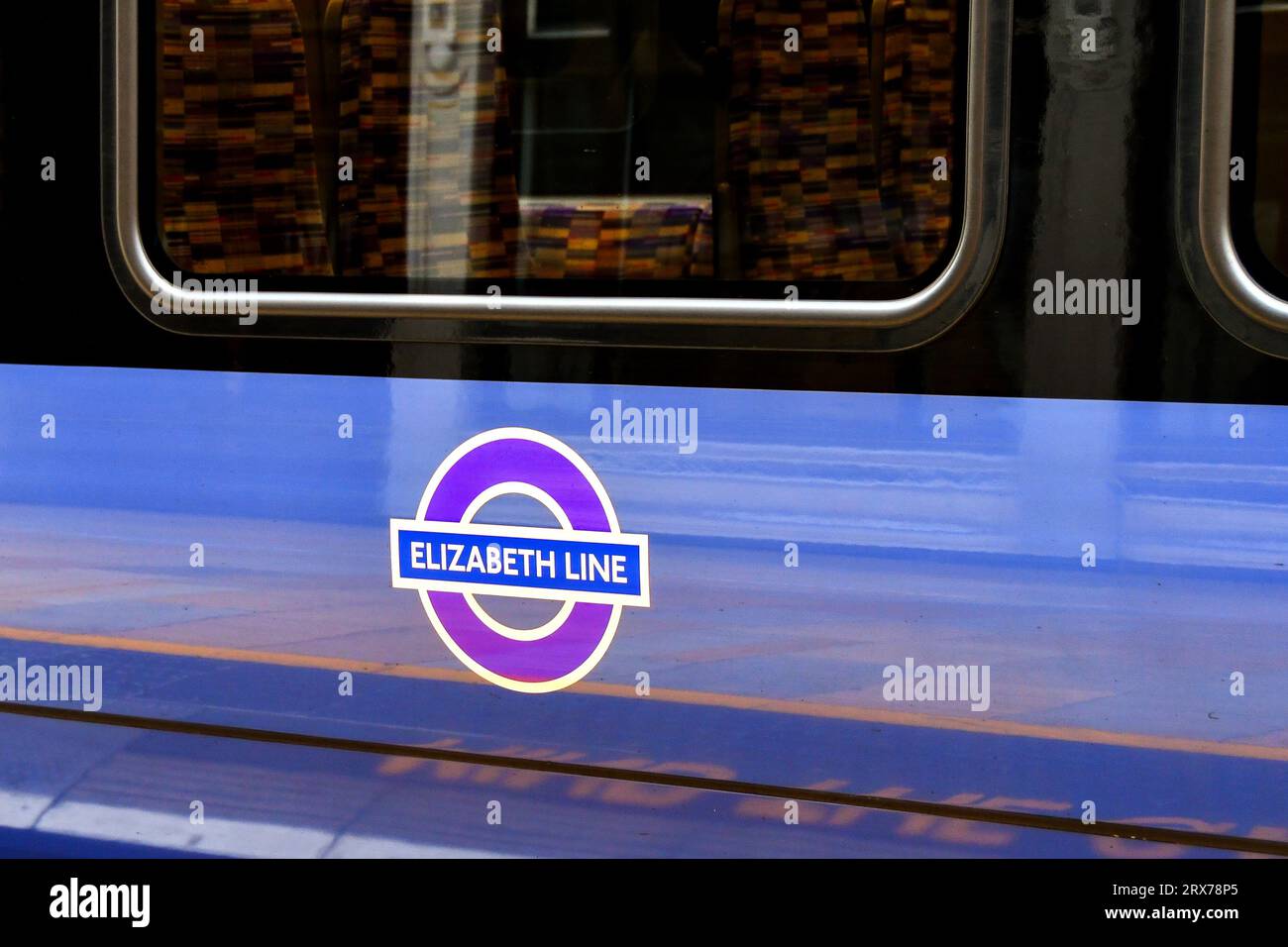 London, Enbgland, UK - 27 June 2023: Close up view of the side of a train on the new Elizabeth Line at London Paddington railway station. Stock Photo