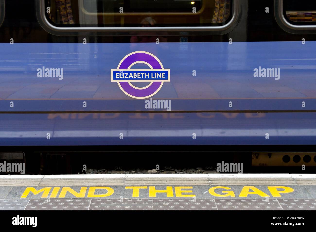 London, England, UK - 27 June 2023: Close up view of the side of a train on the Elizabeth Line at London Paddington railway station and a Mind the Gap Stock Photo