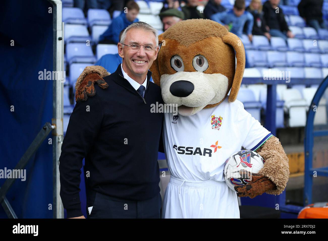 Birkenhead, UK. 23rd Sep, 2023. Nigel Adkins, the Manager of Tranmere Rovers (l) poses for a photo with Rover the Dog, the official mascot of Tranmere Rovers Football Club. EFL Skybet Football league two match, Tranmere Rovers v Accrington Stanley at Prenton Park, Birkenhead, Wirral on Saturday 23rd September 2023. this image may only be used for Editorial purposes. Editorial use only, .pic by Chris Stading/ Credit: Andrew Orchard sports photography/Alamy Live News Stock Photo