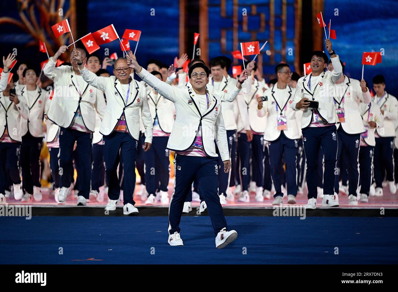 Hangzhou, China's Zhejiang Province. 23rd Sep, 2023. Kenneth Fok Kai-kong of delegation of Hong Kong, China parades into the Hangzhou Olympic Sports Center Stadium during the opening ceremony of the 19th Asian Games in Hangzhou, east China's Zhejiang Province, Sept. 23, 2023. Credit: Song Yanhua/Xinhua/Alamy Live News Stock Photo