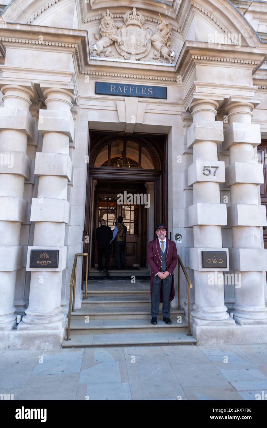 Whitehall, Westminster, London, UK. 23rd Sep, 2023. The Raffles hotel that has been redeveloped from the Old War Office building in Whitehall is due to open on 29th September. A doorman is on hand to discuss the upcoming opening. Part of the building is residential Stock Photo