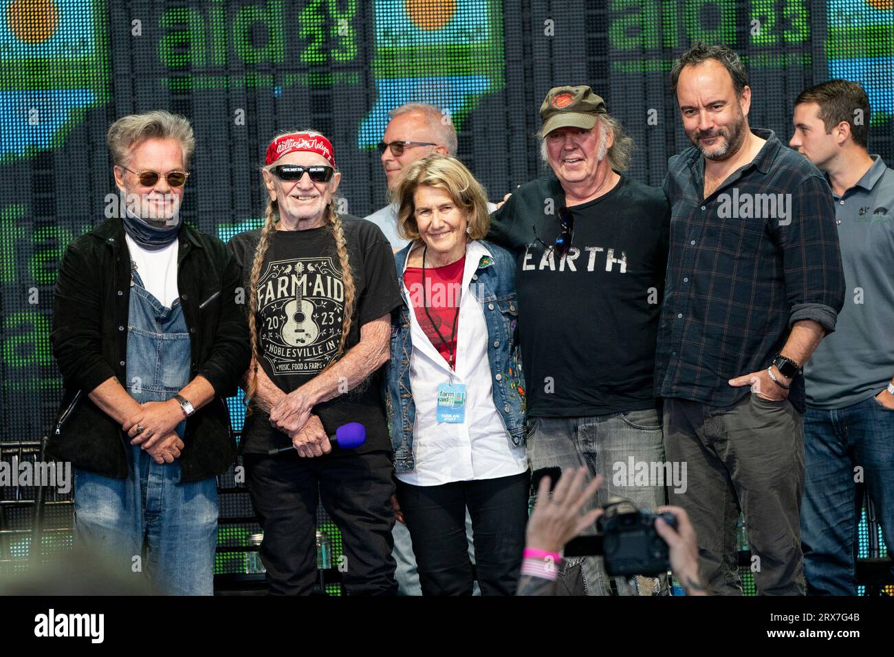 John Mellencamp, left, Willie Nelson, Carolyn Mugar, Neil Young, and