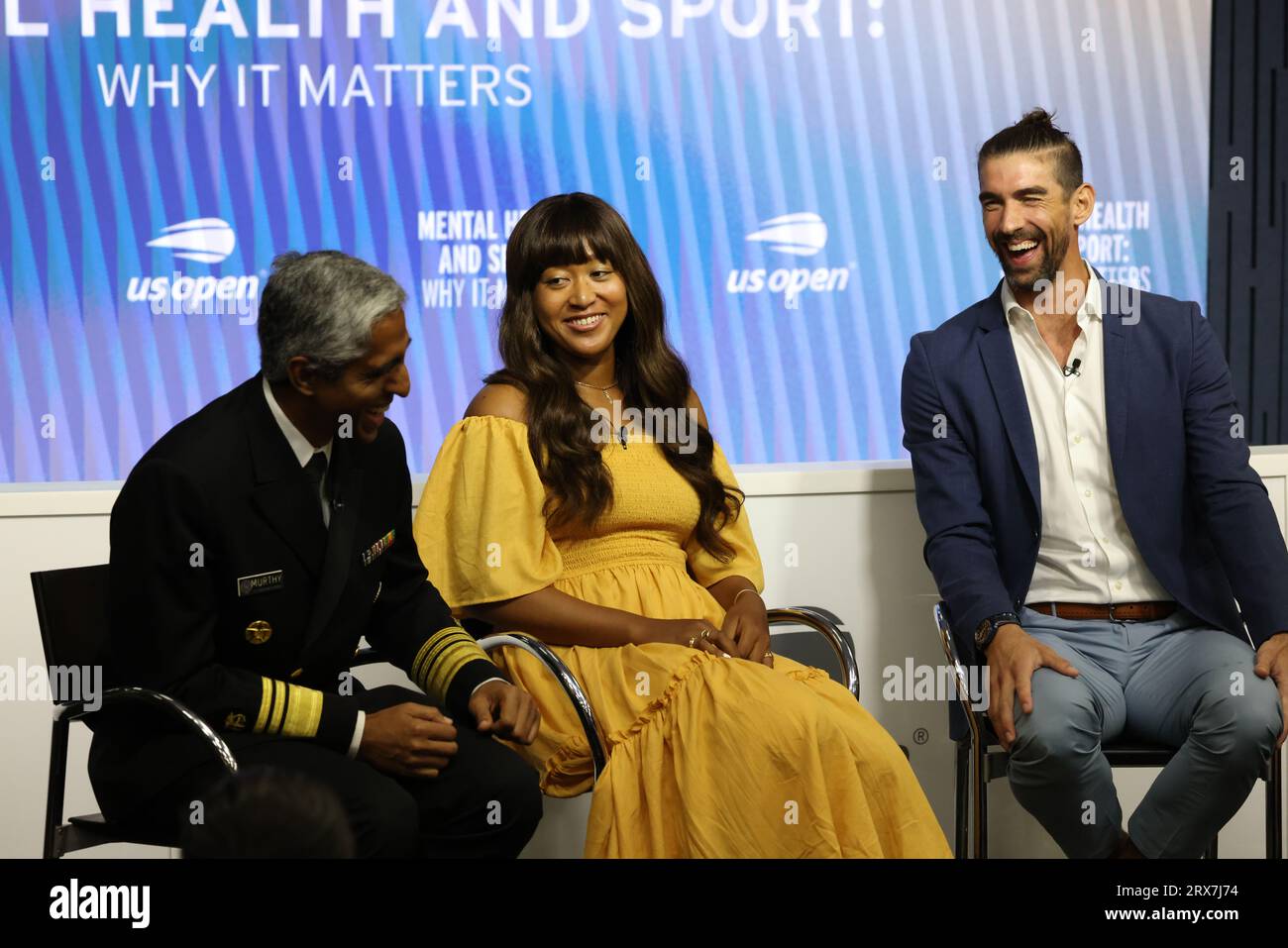 Tennis player Naomi Osaka and Olympic swimmer Michael Phelps share a laugh during Mental Health and Sport Press conference at US Open on 6 September 2023.  From Left to Right:  Also in attendance were US Surgeon General  Dr. Vivek H. Murthy, left, and USTA President Dr. Brian Hainline, out of frame. Stock Photo