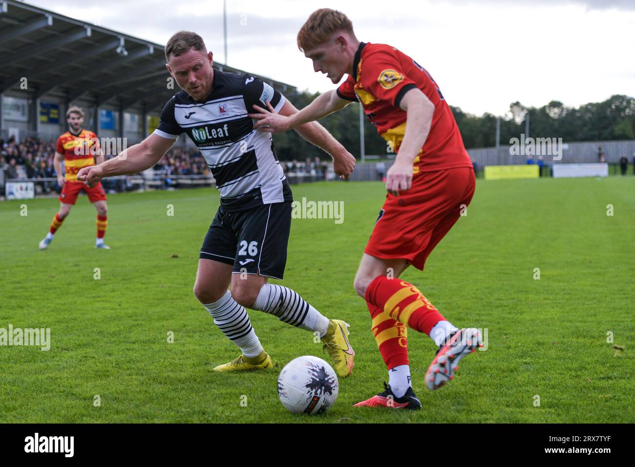 Gloucester city fc harry emmett looks to clear his line under pressure
