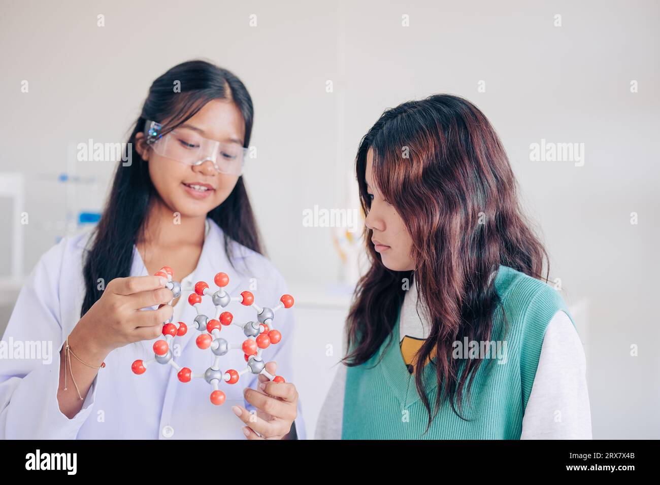 Children teen role playing scientist at fun science chemical lab workshop for learning education in school Stock Photo