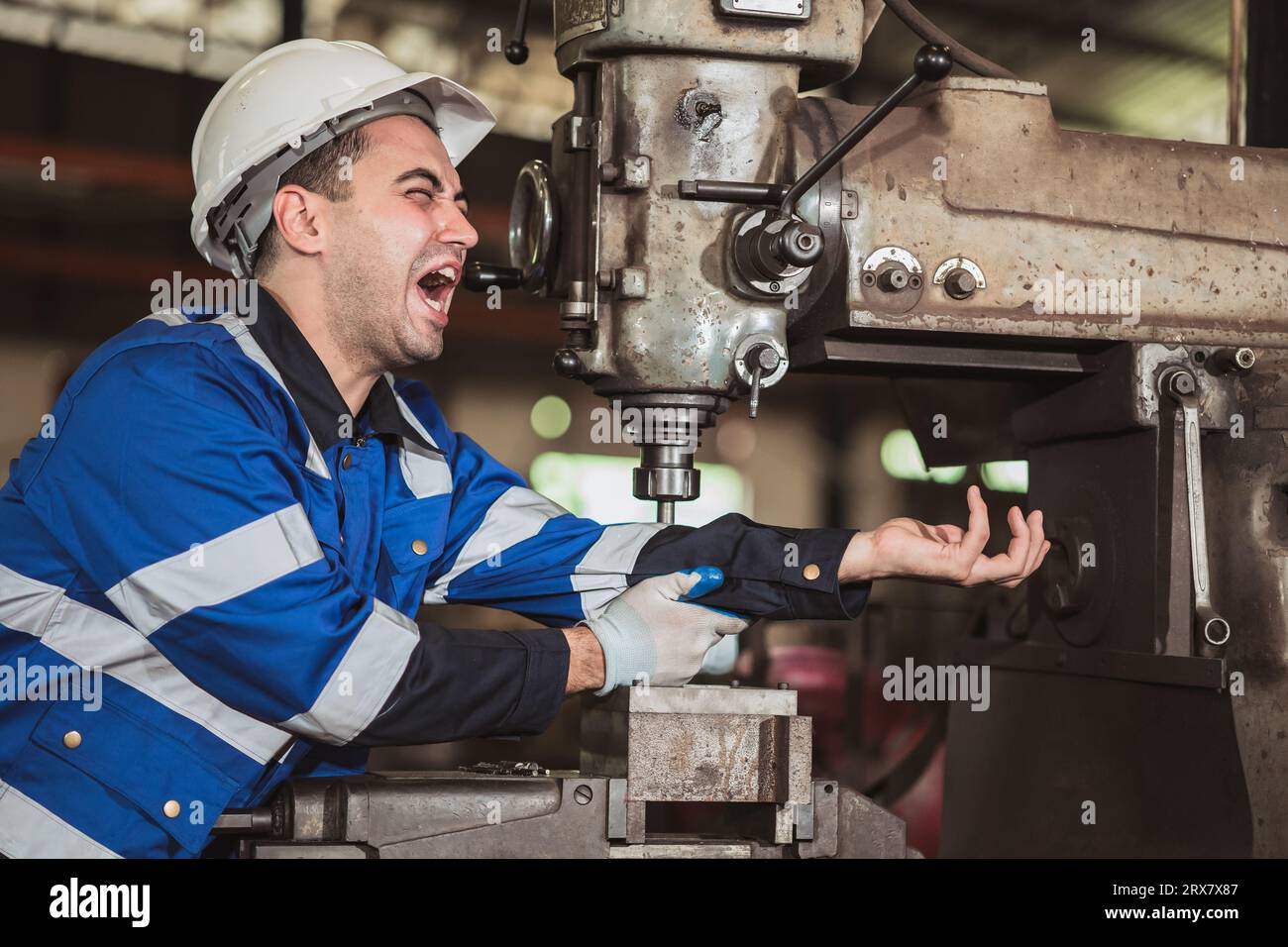 Worker serious accident arm injury from old unsafety machine in heavy