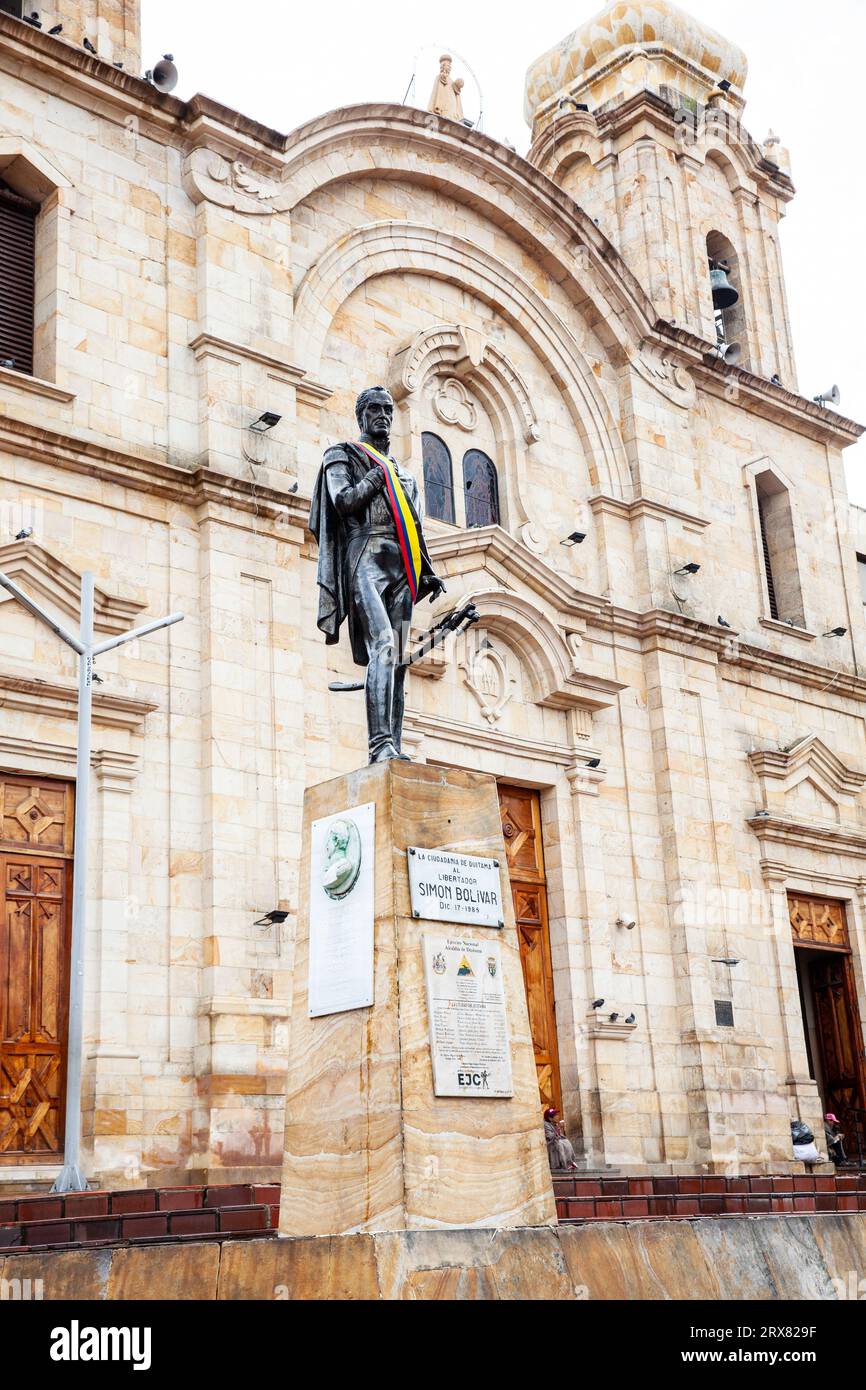 Duitama, Colombia - August 9th 2023. Bolivar statue located next to the historical Saint Lawrence Cathedral in Duitama which construction started in 1 Stock Photo