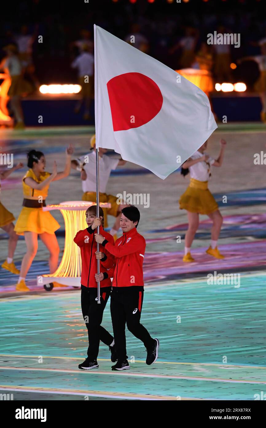 Hangzhou, China. 23rd Sep, 2023. Misaki Emura (L) and Akihito Shimizu (R) of Japan are seen bearing the flag of Japan during the 19th Asian Games opening ceremony held at the Hangzhou Olympic Sports Center Stadium. Credit: SOPA Images Limited/Alamy Live News Stock Photo