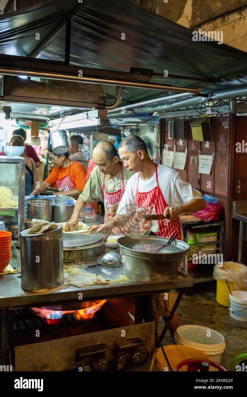 Preparing Char Kaoy Teow on Lebuh Carnarvon (Food Street),