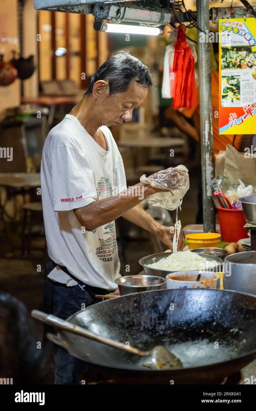 Preparing Char Kaoy Teow on Lebuh Carnarvon (Food Street),
