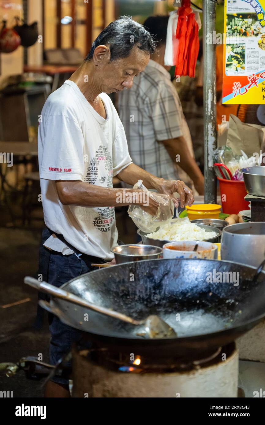 Preparing Char Kaoy Teow on Lebuh Carnarvon (Food Street),