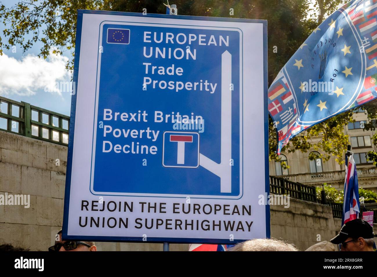 23 September 2023. London, UK. Around 3,000 pro-EU campaigners and supporters participate in a National Rejoin March and rally in central London. Campaigners claim Brexit has been a disaster for the UK and demand the country re-establishes its membership of the European Union. Pictured: A placard in the form of a motorway sign depicting a choice between membership of the EU as a route to prosperity or Brexit as a dead-end for the country. Stock Photo