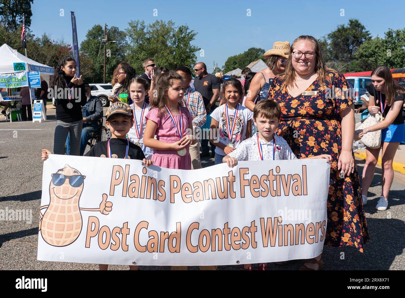 Plains, United States. 23rd Sep, 2023. Children line up on Main Street as they prepare to march at the 26th annual Plains Peanut Festival in honor of former President Jimmy Carter, September 23, 2023 in Plains, Georgia. Former President Jimmy Carter and his wife Rosalynn Carter were briefly spotted at the festival inside a private vehicle. Credit: Richard Ellis/Richard Ellis/Alamy Live News Stock Photo