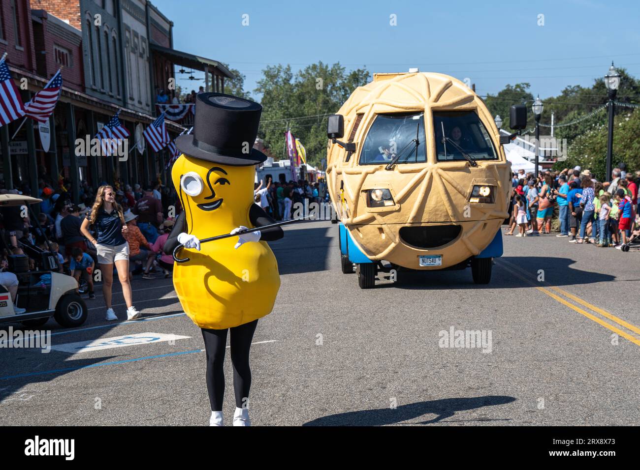 Plains, United States. 23rd Sep, 2023. Mr Peanut dances down Main Street followed by the Nutmobile during the 26th annual Plains Peanut Festival in honor of former President Jimmy Carter, September 23, 2023 in Plains, Georgia. Former President Jimmy Carter and his wife Rosalynn Carter, life-long residents of the village were briefly spotted at the festival inside a private vehicle. Credit: Richard Ellis/Richard Ellis/Alamy Live News Stock Photo