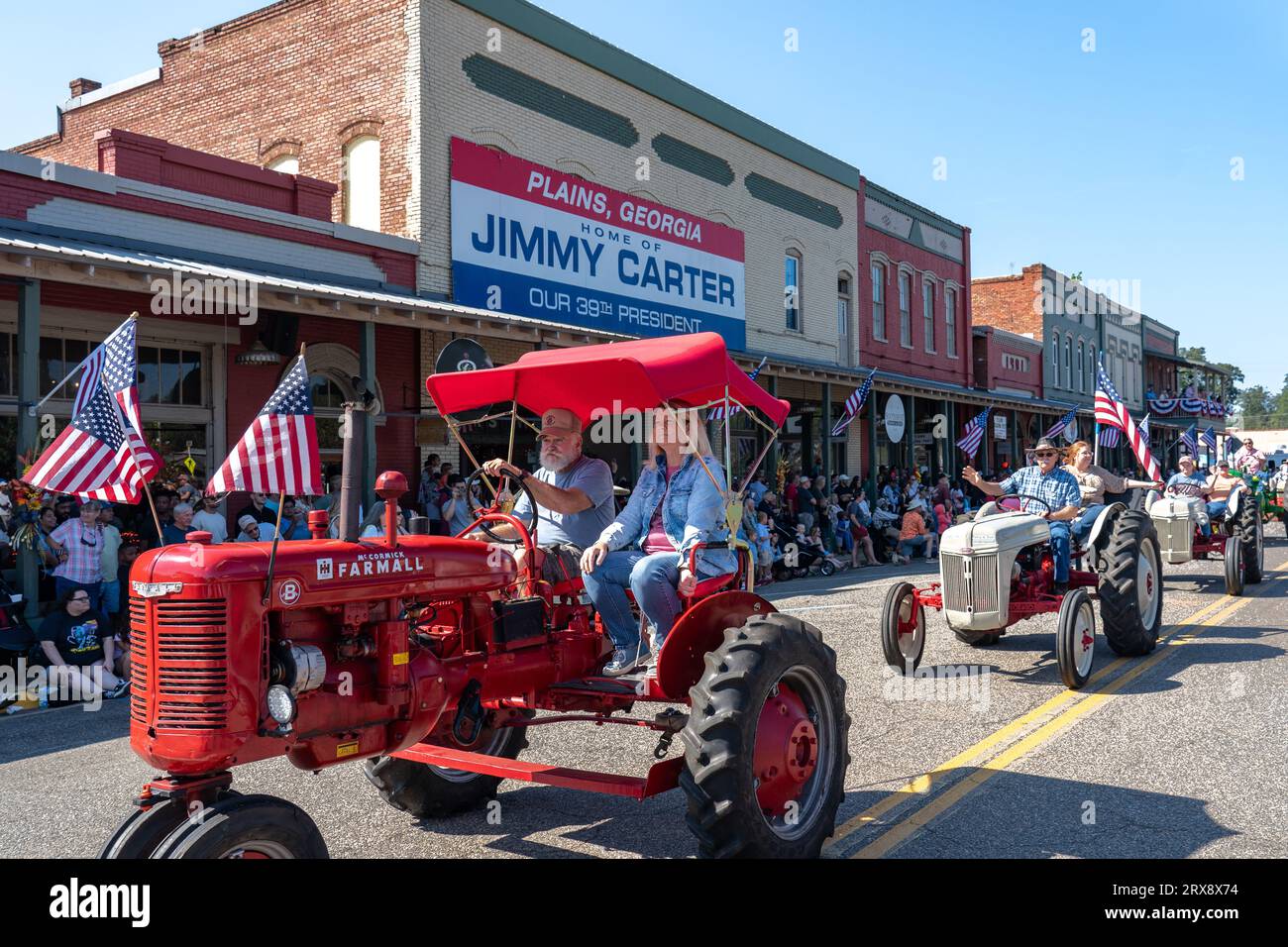 Plains, United States. 23rd Sep, 2023. Antique farm tractors process down Main Street during the 26th annual Plains Peanut Festival in honor of former President Jimmy Carter, September 23, 2023 in Plains, Georgia. Former President Jimmy Carter and his wife Rosalynn Carter, life-long residents of the village were briefly spotted at the festival inside a private vehicle. Credit: Richard Ellis/Richard Ellis/Alamy Live News Stock Photo