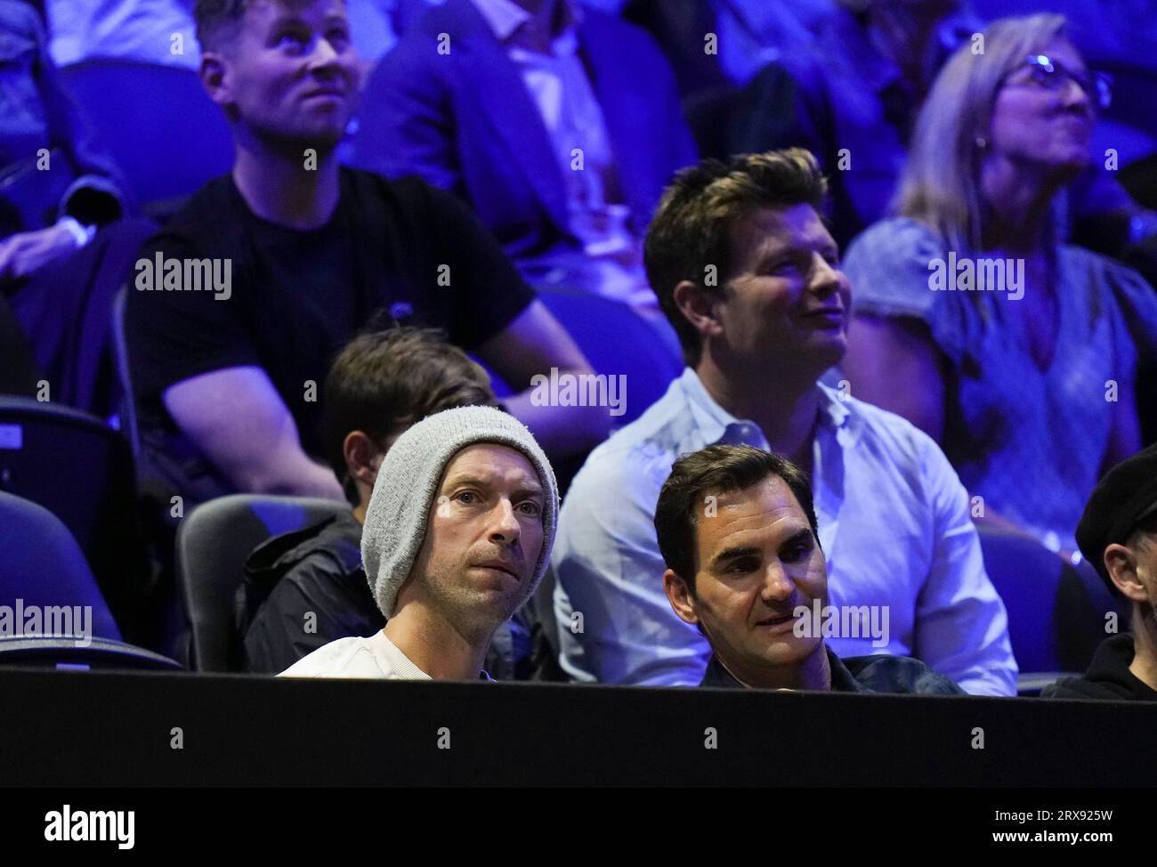 Coldplay lead singer Chris Martin, bottom left, and former tennis player Roger Federer watch Team Worlds Tommy Paul and Team Europes Casper Ruud play during a Laver Cup tennis match Saturday, Sept.